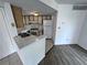 Efficient kitchen space with white appliances, tile flooring and ample cabinet storage at 1908 Lake Atriums Cir # 20, Orlando, FL 32839