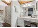 Bright bathroom features a shower/tub, vanity with makeup table, and wood ceiling at 200 Maitland Ave # 28, Altamonte Springs, FL 32701