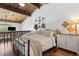 Stylish bedroom featuring a vaulted wood ceiling, hardwood floors and a comfortable bed at 200 Maitland Ave # 28, Altamonte Springs, FL 32701
