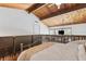Bright bedroom with wood ceiling and railing overlooking the living area at 200 Maitland Ave # 28, Altamonte Springs, FL 32701