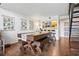 Dining area featuring a large dining table, bar seating, and access to the kitchen at 200 Maitland Ave # 28, Altamonte Springs, FL 32701