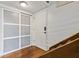 Bright entryway featuring closet and front door adjacent to staircase with wood flooring at 200 Maitland Ave # 28, Altamonte Springs, FL 32701