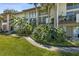 Condominium exterior featuring well-maintained landscaping and a charming walkway at 200 Maitland Ave # 28, Altamonte Springs, FL 32701