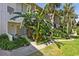 Condominium exterior shows lush landscaping near entrance, adding to the building's curb appeal at 200 Maitland Ave # 28, Altamonte Springs, FL 32701