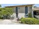Exterior of the townhouse featuring well-maintained landscaping and a private entrance at 200 Maitland Ave # 28, Altamonte Springs, FL 32701