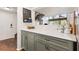 Cozy kitchen featuring gray cabinets, white quartz countertops, and a welcoming entryway at 200 Maitland Ave # 28, Altamonte Springs, FL 32701