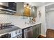 Updated kitchen with stainless steel appliances, white backsplash, and modern fixtures at 200 Maitland Ave # 28, Altamonte Springs, FL 32701