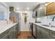 Well-appointed kitchen features stainless steel appliances, granite counters and hardwood floors at 200 Maitland Ave # 28, Altamonte Springs, FL 32701