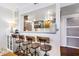 Kitchen area featuring bar seating, stainless steel appliances, and stylish cabinetry at 200 Maitland Ave # 28, Altamonte Springs, FL 32701