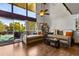 Bright living room featuring hardwood floors, seating area, and natural light from the large windows at 200 Maitland Ave # 28, Altamonte Springs, FL 32701