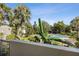 Scenic view from the balcony showcasing the inviting pool area surrounded by tropical foliage at 200 Maitland Ave # 28, Altamonte Springs, FL 32701