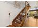Stylish staircase leading to upper level, with a view of the living area and outdoor scenery at 200 Maitland Ave # 28, Altamonte Springs, FL 32701