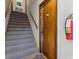 Hallway with stairs leading to upper levels and an entryway door at 200 Maitland Ave # 28, Altamonte Springs, FL 32701