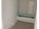 Bathroom with tiled walls and a standard bathtub installed at 2389 Zuni Road, St Cloud, FL 34771