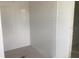 This is a bathroom shower area with white subway tile from floor to ceiling at 2389 Zuni Road, St Cloud, FL 34771