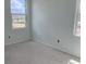 Bright bedroom featuring fresh paint and large windows, allowing natural light to illuminate the space at 2389 Zuni Road, St Cloud, FL 34771
