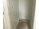 This is an empty walk-in closet featuring fresh paint and standard depth at 2389 Zuni Road, St Cloud, FL 34771
