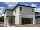 Two-story home featuring a covered entry, a two-car carport and light tan siding at 2389 Zuni Road, St Cloud, FL 34771