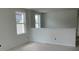 Bright hallway space featuring fresh paint and large windows, allowing natural light to illuminate the space at 2389 Zuni Road, St Cloud, FL 34771