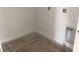 Unfinished laundry room with hookups, ready for washer, dryer, and customization, awaiting personalization at 2389 Zuni Road, St Cloud, FL 34771