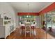 Dining area featuring a round table, bright window, and a view to the outdoors at 24104 Peekskill St, Leesburg, FL 34748