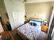 Well-lit bedroom featuring closet, floral-patterned bed, and complementary decor at 2426 Hybrid Dr, Kissimmee, FL 34758