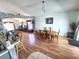 Open dining area with wood flooring adjacent to the kitchen and living spaces at 2426 Hybrid Dr, Kissimmee, FL 34758