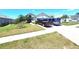 Inviting two-story home with lush landscaping and a spacious driveway at 2426 Hybrid Dr, Kissimmee, FL 34758