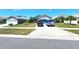 Charming single-Gathering home with well-maintained lawn and large driveway at 2426 Hybrid Dr, Kissimmee, FL 34758