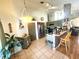 Modern kitchen featuring tiled floors, stainless appliances, and ample cabinet space at 2426 Hybrid Dr, Kissimmee, FL 34758