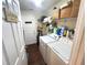 Functional laundry room equipped with modern washer and dryer units at 2426 Hybrid Dr, Kissimmee, FL 34758