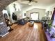 Open concept living room with vaulted ceilings, wood floors, and stone design accents at 2426 Hybrid Dr, Kissimmee, FL 34758
