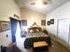 Bright main bedroom with high ceilings, tropical bedding, and ample natural light at 2426 Hybrid Dr, Kissimmee, FL 34758