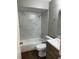 Bathroom with modern fixtures, including a sleek vanity and shower-tub combination at 2520 Park Lake Dr, Deland, FL 32724