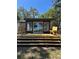 Modern home addition featuring wooden deck and seating at 2520 Park Lake Dr, Deland, FL 32724