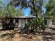 Charming home with decorative pergola and mature trees in a sunny setting at 2520 Park Lake Dr, Deland, FL 32724