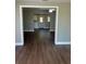 Spacious living room featuring hardwood floors, fresh paint and plenty of natural light at 2520 Park Lake Dr, Deland, FL 32724