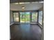 Inviting room with natural light and glass sliding doors showcasing the beautiful outdoor scenery at 2520 Park Lake Dr, Deland, FL 32724