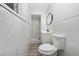 Updated bathroom featuring a new vanity, modern lighting, toilet, shower, and attractive tile at 2614 Rio Ln, Orlando, FL 32805
