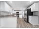Bright kitchen featuring white cabinetry, stainless steel appliances, and granite countertops at 2614 Rio Ln, Orlando, FL 32805