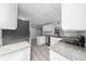 Modern kitchen showcasing granite countertops, stainless steel appliances, and ample cabinet space at 2614 Rio Ln, Orlando, FL 32805