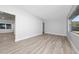 Open living space with sleek gray wood flooring and light gray walls at 2614 Rio Ln, Orlando, FL 32805