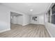Bright living room featuring neutral walls, gray wood flooring, and ample light at 2614 Rio Ln, Orlando, FL 32805