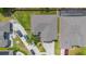 Bird's eye view of a home with a large driveway, mature landscaping, and a well-maintained roof at 289 Magnolia Park Trl, Sanford, FL 32773
