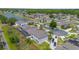 Overhead view of the property located by a lake, highlighting its community setting and mature trees at 289 Magnolia Park Trl, Sanford, FL 32773