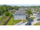 Aerial view of the home with a fenced backyard, driveway and mature trees at 289 Magnolia Park Trl, Sanford, FL 32773