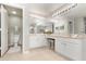 Well-lit bathroom with double vanity, toilet, and large mirror, offering space and functionality at 289 Magnolia Park Trl, Sanford, FL 32773