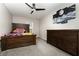 Bedroom with an accent wall, wooden furniture, and a large window providing ample natural light at 289 Magnolia Park Trl, Sanford, FL 32773