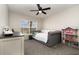 Cozy bedroom with window view, daybed, and dollhouse at 289 Magnolia Park Trl, Sanford, FL 32773