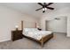 Spacious bedroom with a large bed, ceiling fan, and walk-through entry to a connected room at 289 Magnolia Park Trl, Sanford, FL 32773